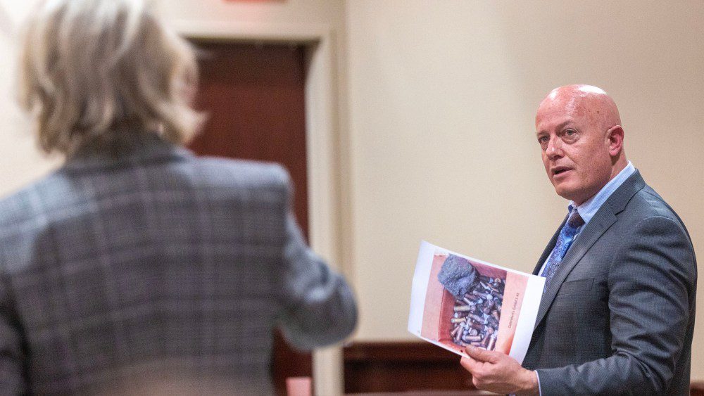 Special prosecutor Kari Morrissey, left, and Jason Bowles defense attorney, discuss weather the picture in his hands can be shown to the witness during the trail for Hannah Gutierrez-Reed, the former armorer on the set of the movie Rust, at district court on Wednesday, Feb. 27, 2024.