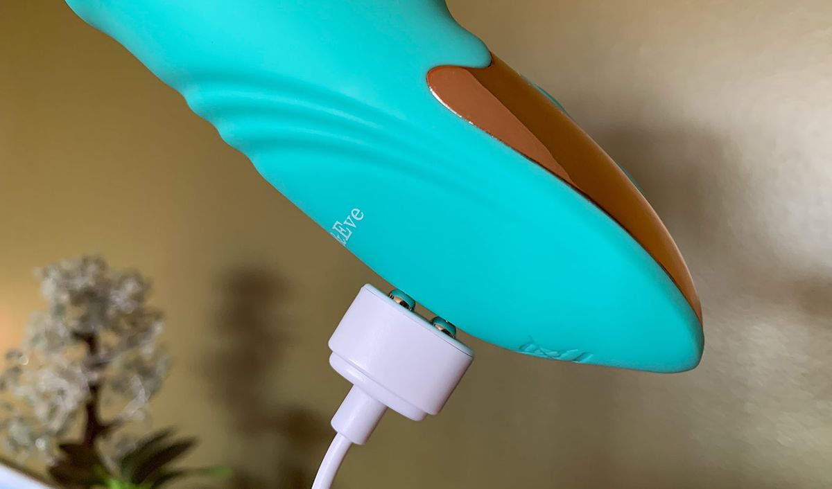 A vibrator with a magnetically attached USB cable