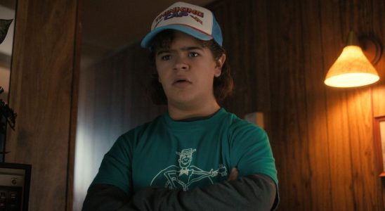 A press image of Dustin crossing his arms in Season 4 of Stranger Things.