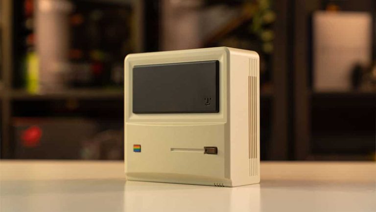 An apple computer sitting on a table.