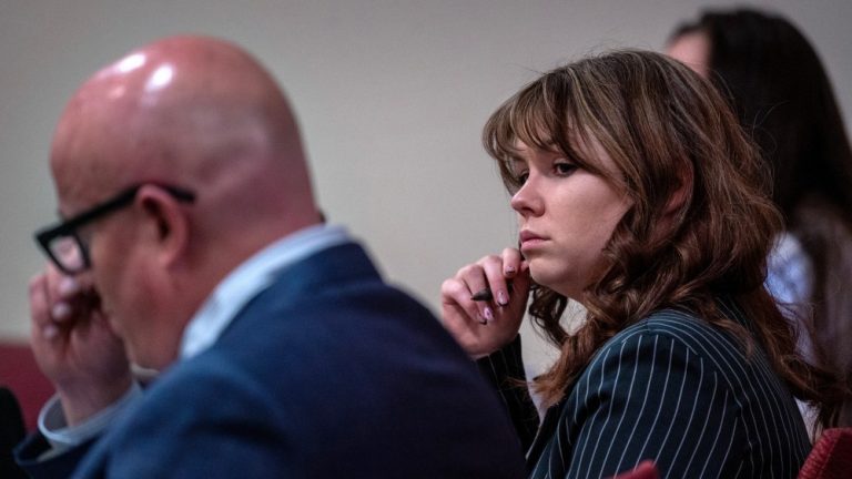 Hannah Gutierrez Reed, center, sits with her attorney Jason Bowles, left, during testimony in the trial against her in First District Court, in Santa Fe, N.M., Friday, March, 1, 2024. Gutierrez-Reed, who was working as the armorer on the movie "Rust" when a revolver actor Alec Baldwin was holding fired killing cinematographer Halyna Hutchins and wounded the film’s director Joel Souza, is charged with involuntary manslaughter and tampering with evidence.