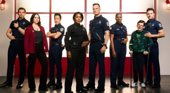 From L to R: Oliver Stark, Jennifer Love Hewitt, Kenneth Choi, Angela Bassett, Peter Krause, Aisha Hinds, Gavin McHugh, and Ryan Guzman pose for 9-1-1 Season 7.