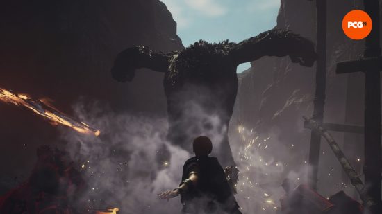 Dragons Dogma 2 filou debout devant un ogre massif