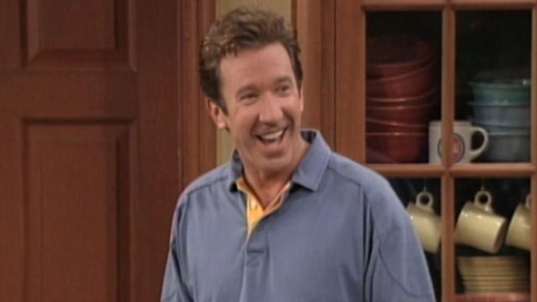 Tim Taylor smiling inside house in Home Improvement