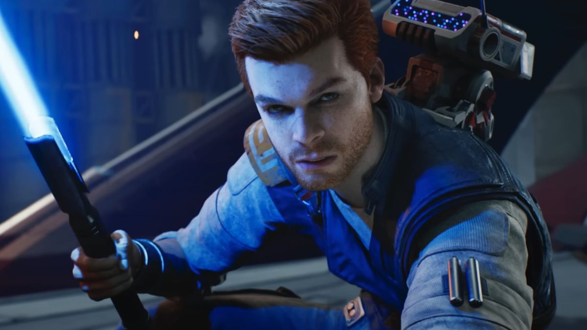 Cameron Monaghan poses with a lit lightsaber in Star Wars: Jedi Survivor.