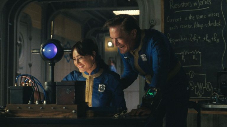 Ella Purnell and Kyle MacLachlan share a laugh around a scientific device in Fallout.