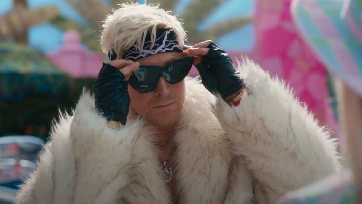 Ryan Gosling as Ken putting on a pair of sunglasses while already wearing sunglasses in the Barbie movie. 