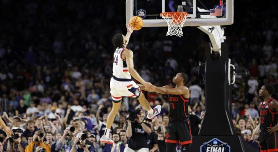 Andre Jackson Jr. #44 of the Connecticut Huskies is fouled as he drives to the basket against Micah Parrish #3 of the San Diego State Aztecs during the second half during the NCAA Men's Basketball Tournament National Championship game at NRG Stadium April 03, 2023 in Houston, Texas.