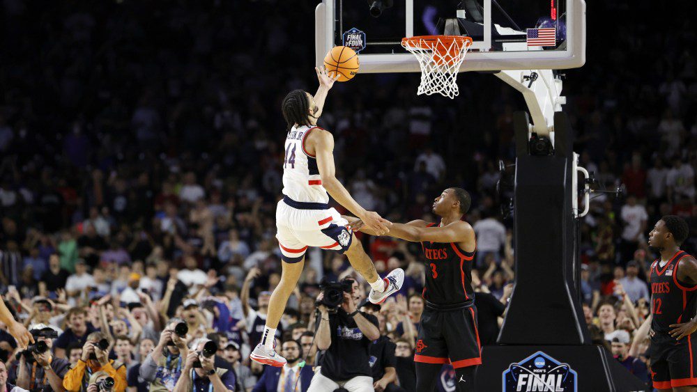 Andre Jackson Jr. #44 of the Connecticut Huskies is fouled as he drives to the basket against Micah Parrish #3 of the San Diego State Aztecs during the second half during the NCAA Men's Basketball Tournament National Championship game at NRG Stadium April 03, 2023 in Houston, Texas.