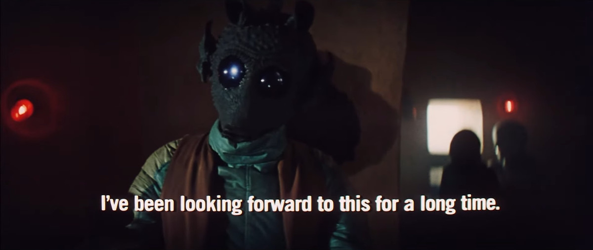 une capture d'écran de Greedo dans Star Wars de 1977 avec des légendes qui disent 