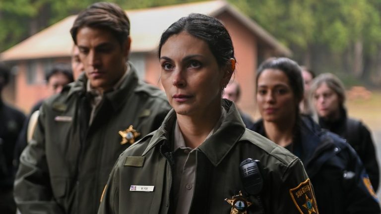 Morena Baccarin standing in front of other officers from the Sheriff