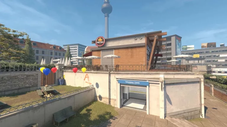 CS2's Overpass map, showing the grassy party area and ticket office in the middle of the map.