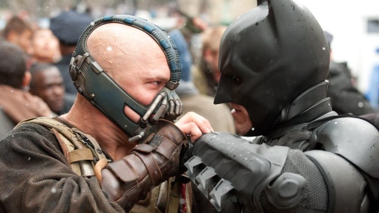 THE DARK KNIGHT RISES, from left: Tom Hardy, Christian Bale as Batman, 2012. ph: Ron Phillips/©Warner Bros./courtesy Everett Collection