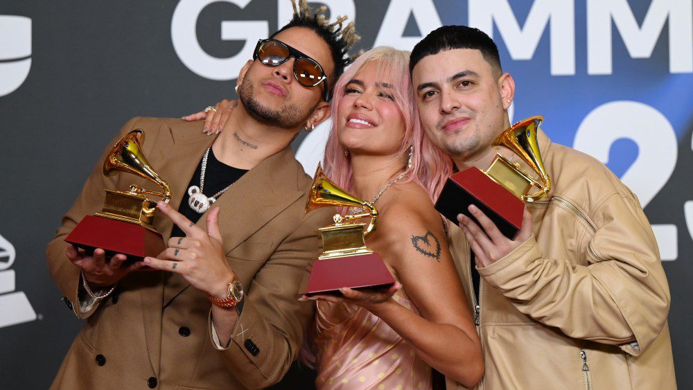 SEVILLE, SPAIN - NOVEMBER 16: (L-R) Ovy On The Drums, Karol G, and  Kevyn Mauricio Cruz pose with awards during The 24th Annual Latin Grammy Awards on November 16, 2023 in Seville, Spain. (Photo by Borja B. Hojas/Getty Images for Latin Recording Academy)