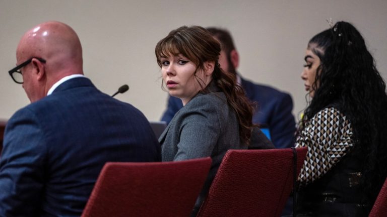 Hannah Gutierrez-Reed, center, sits with her attorney Jason Bowles, left, during the first day of testimony in the trial against her in First District Court, in Santa Fe, N.M., Thursday, February 22, 2024. Gutierrez-Reed, who was working as the armorer on the movie "Rust" when a revolver actor Alec Baldwin was holding fired killing cinematographer Halyna Hutchins and wounded the film’s director Joel Souza, is charged with involuntary manslaughter and tampering with evidence.