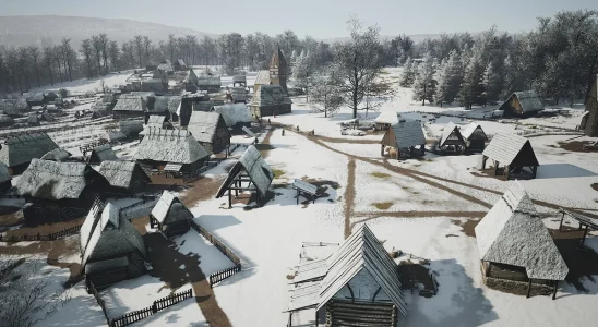 Manor Lords: a wide angle shot showing a snowy village.