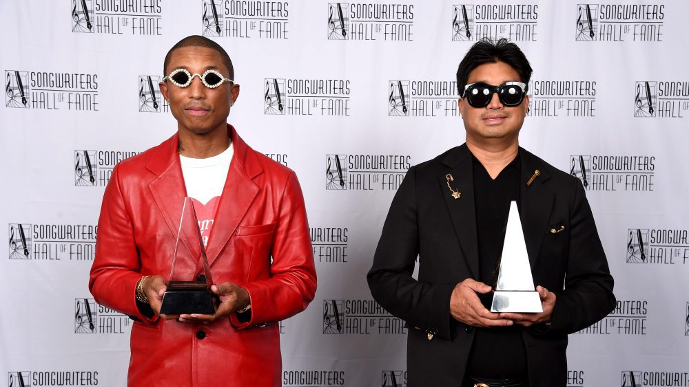 NEW YORK, NEW YORK - JUNE 16: Inductees Pharrell Williams and Chad Hugo of The Neptunes pose backstage at the Songwriters Hall of Fame 51st Annual Induction and Awards Gala at Marriott Marquis on June 16, 2022 in New York City. (Photo by Gary Gershoff/Getty Images for Songwriters Hall of Fame )