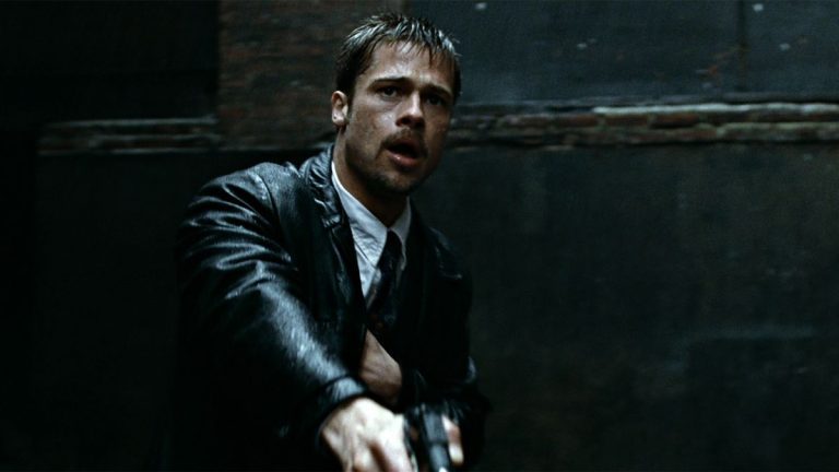 Brad Pitt in the rain with a gun in Se7en