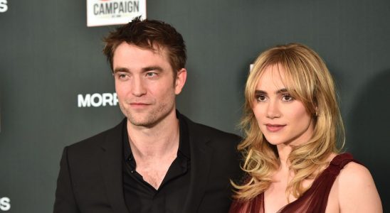 Robert Pattinson and Suki Waterhouse posting on the red carpet