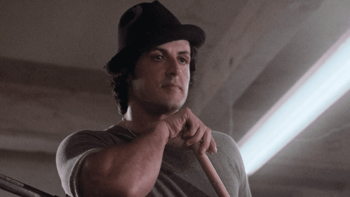 Rocky leaning on broom in Rocky II