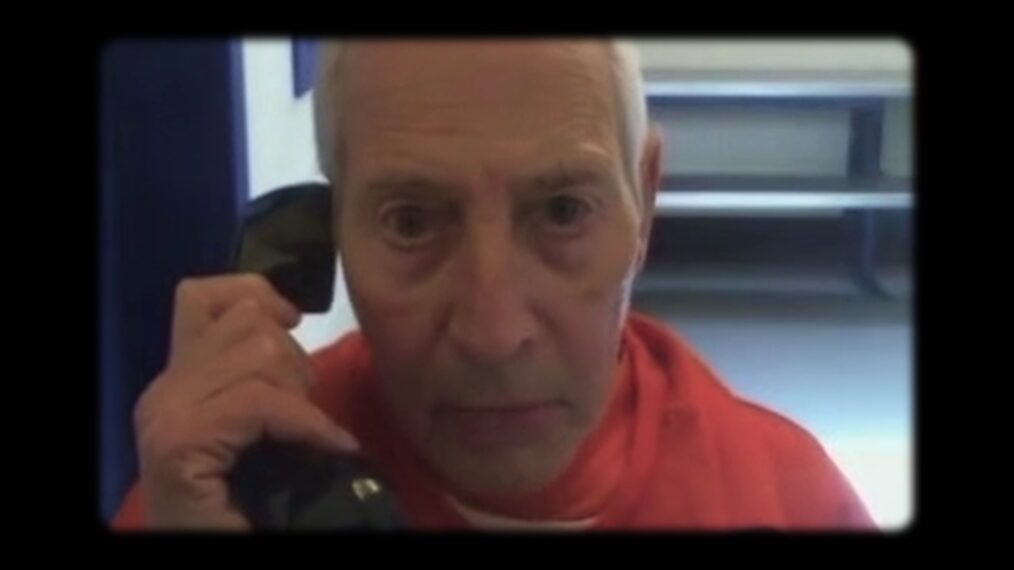 Robert Durst talks on a phone in prison in 