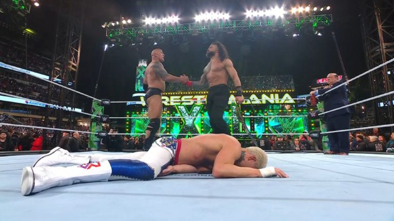 The Rock and Roman Reigns shaking hands after defeating Cody Rhodes at WrestleMania 40