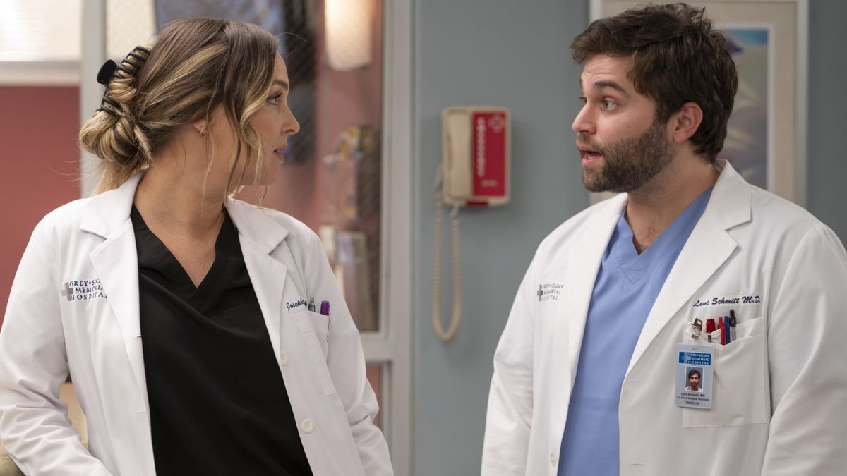 Jo Wilson (Camilla Luddington) talks to a shocked Levi Schmitt (Jake Borelli) in the hospital during an episode of Grey