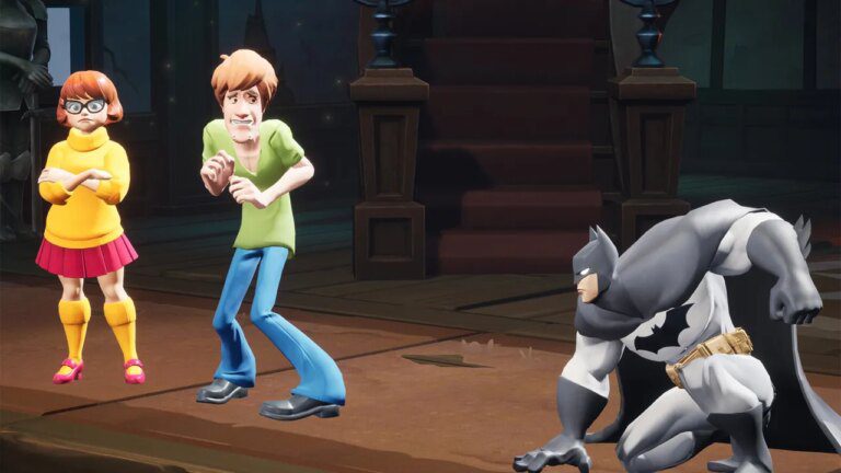 MultiVersus, Shaggy and Velma from Scooby Doo cowering while Batman lands next to them.