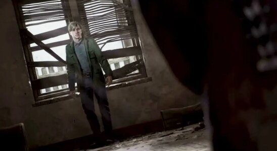 Silent Hill 2, protagonist James Sunderland backing up against a window in a darkened room.