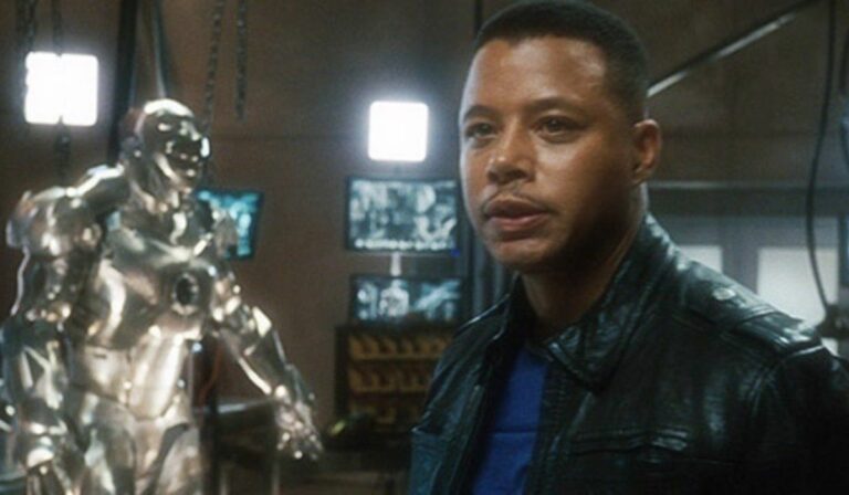 Iron Man Terrence Howard, standing in front of some armor