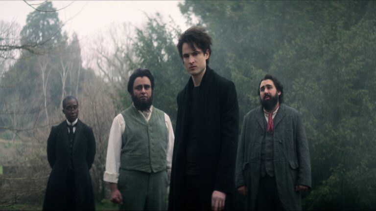 The Sandman. (L to R) Vivienne Acheampong as Lucienne, Sanjeev Bhaskar as Cain, Tom Sturridge as Dream, Asim Chaudhry as Abel in episode 102 of The Sandman.