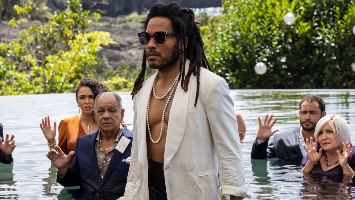 A press image of Lenny Kravitz walking out of a pool in Shotgun Wedding.