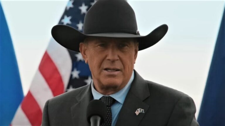 John Dutton and American flag in Yellowstone