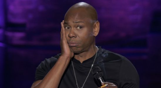 Dave Chappelle with hand on cheek in The Dream stand-up special