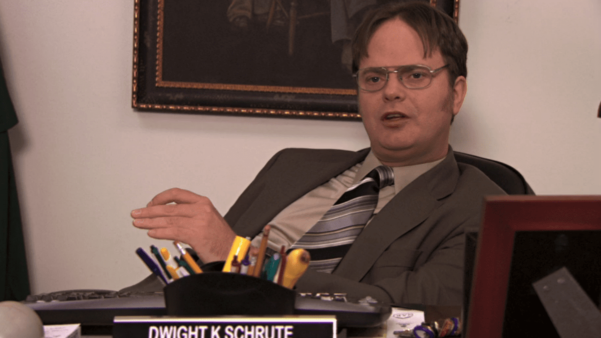 Rainn Wilson as Dwight Schrute talking while at his desk in The Office, Season 7, Episode 10 