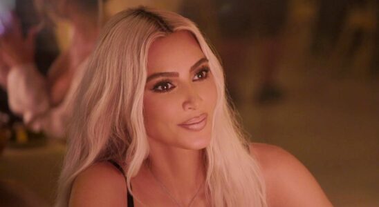 Kim Kardashian sitting in front of a candle in The Kardashians.