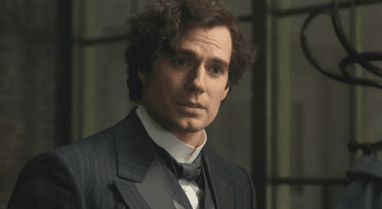 Henry Cavill looking off as Sherlock Holmes in Enola Holmes 2