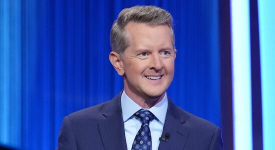 Ken Jennings in navy jacket hosting Celebrity Jeopardy