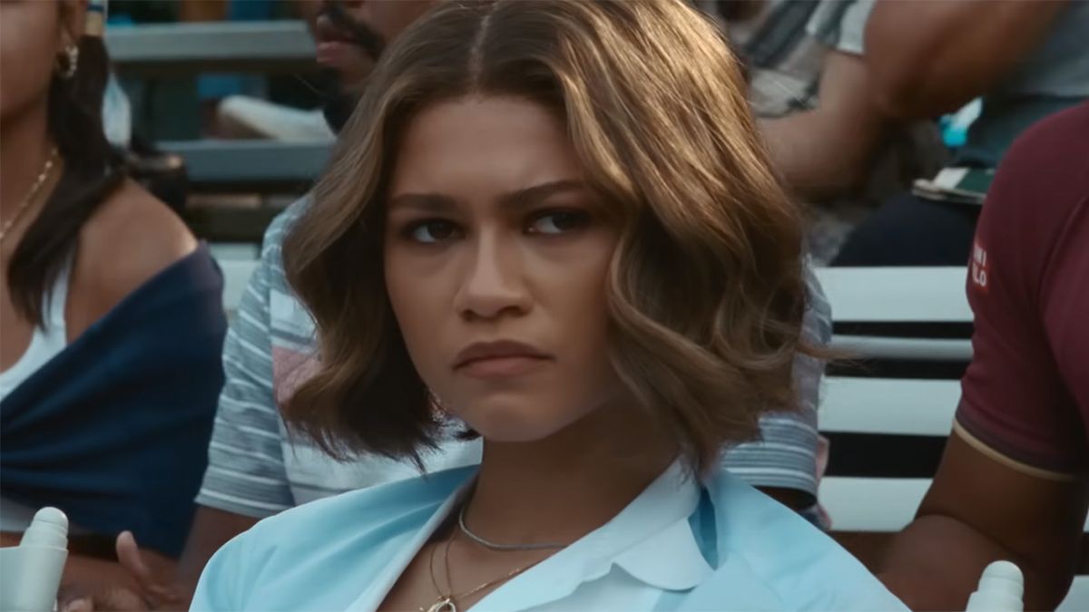 Zendaya in the trailer for Challengers watching a tennis match.