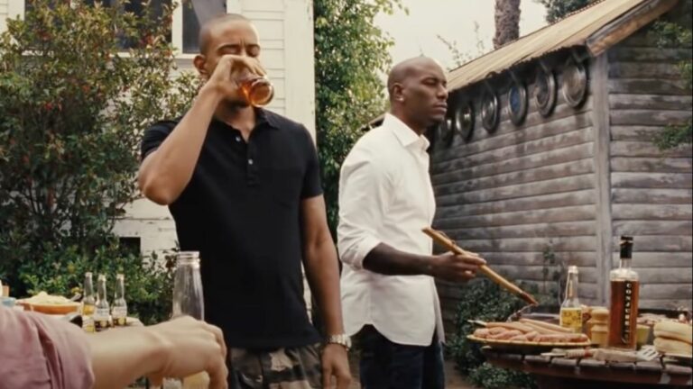 Ludacris sipping drink and Tyrese Gibson working at grill in Fast and Furious 6