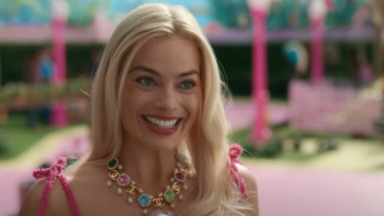 Margot Robbie smiling in Barbie.