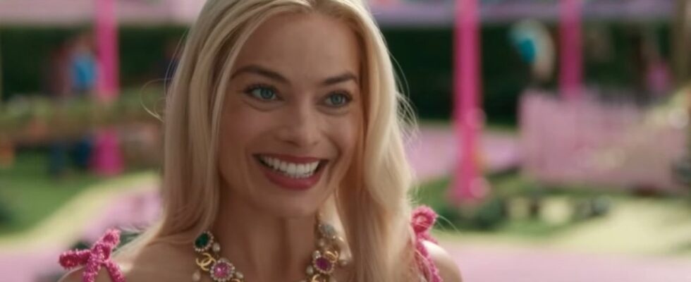 Margot Robbie smiling in Barbie.