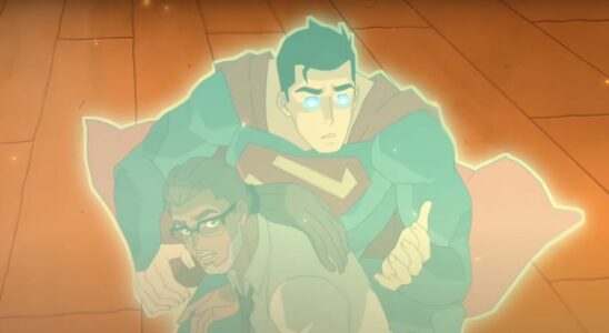 Superman emitting an energy aura protecting him and Silas Stone in burning apartment