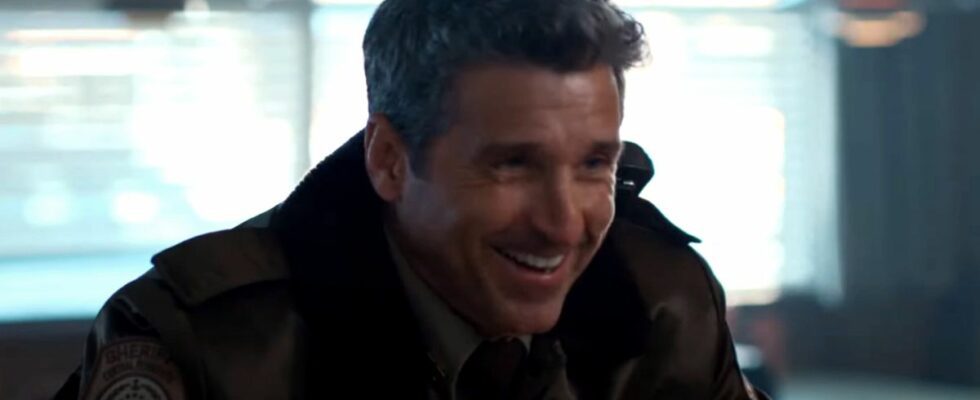 Patrick Dempsey laughs at a diner counter in uniform in Thanksgiving.