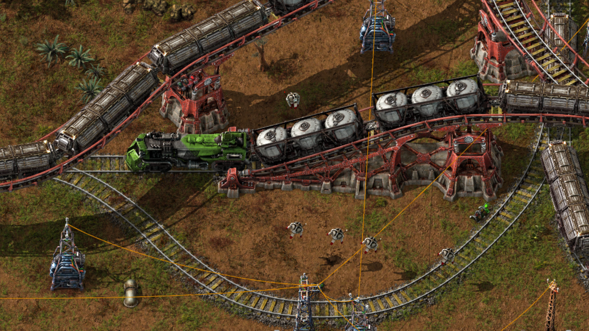 Factorio Space Age DLC - Nouvelles lignes ferroviaires surélevées circulant sur des infrastructures inférieures.