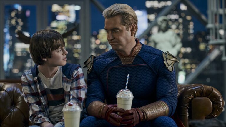 Homelander holding a milkshake while sitting on the couch talking to Ryan in The Boys Season 4