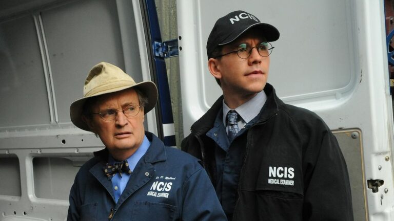 David McCallum and Brian Dietzen next to autopsy van in NCIS