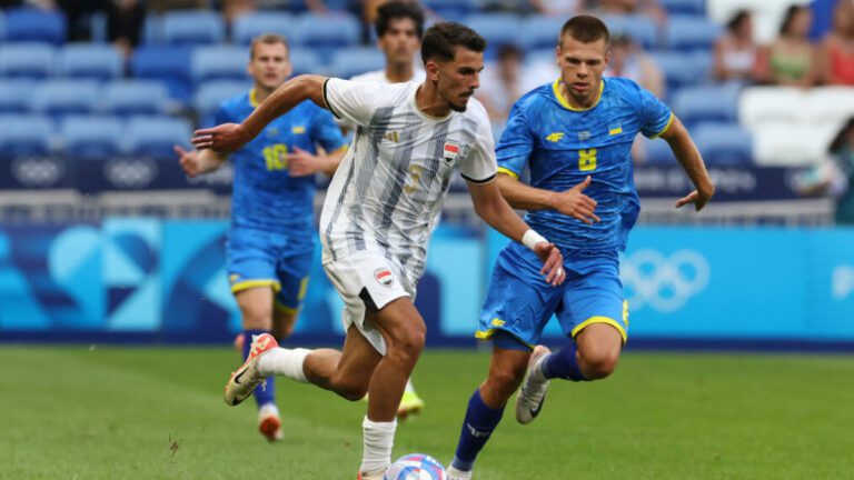 LYON, FRANCE - JULY 24: Mykola Mykhailenko of Ukraine and Hussein Ali of Iraq compete for the ball during the Men