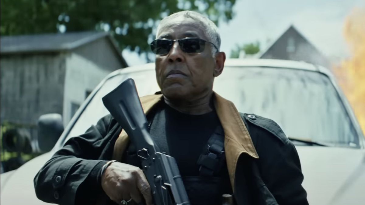 Giancarlo Esposito wearing sunglasses and holding rifle in Captain America: Brave New World