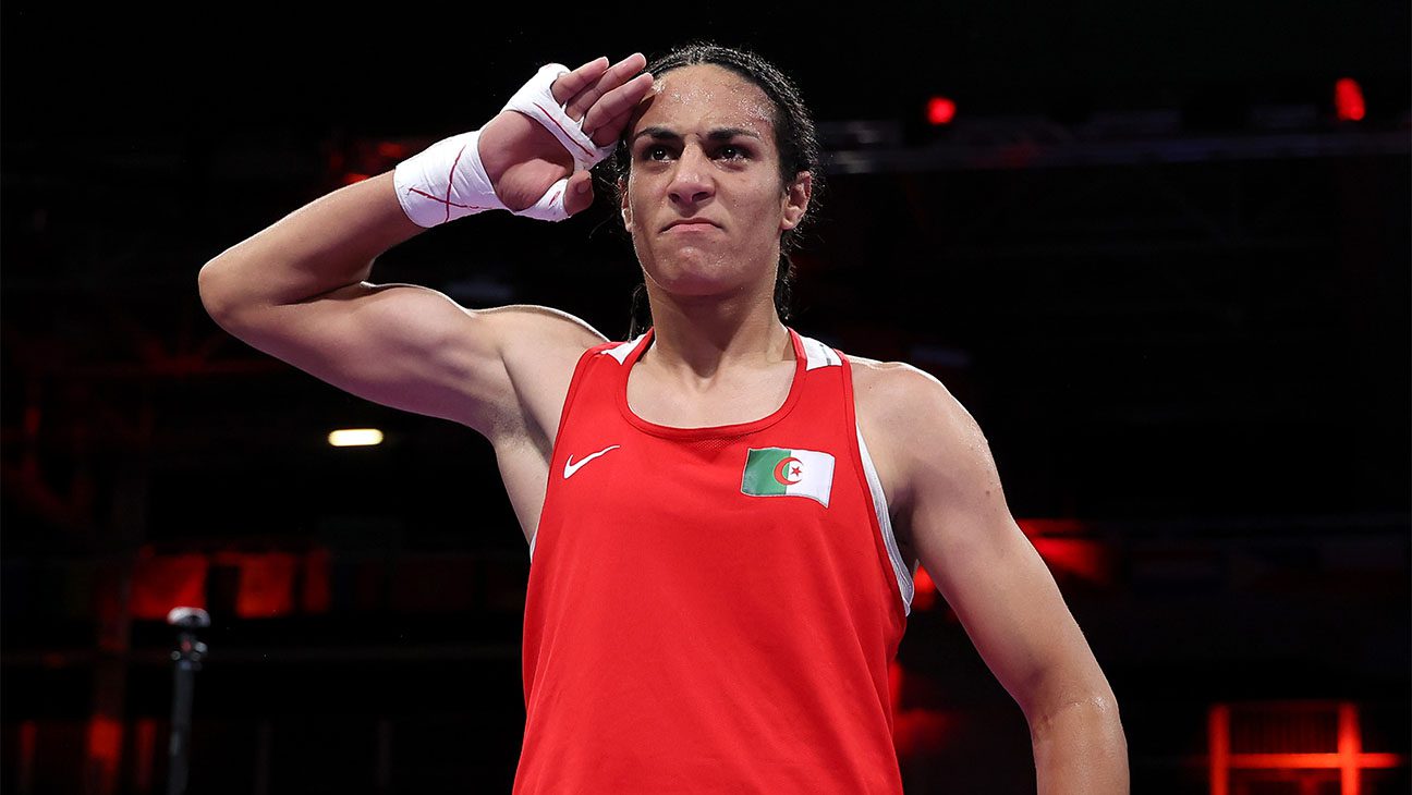 Imane Khelif celebrates victory against Anna Luca Hamori of Team Hungary at 2024 Olympics.